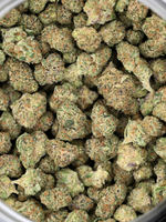 Top Gun hybrid exotic smalls showing crystal trichomes and bright orange hairs | August Cannabis Club